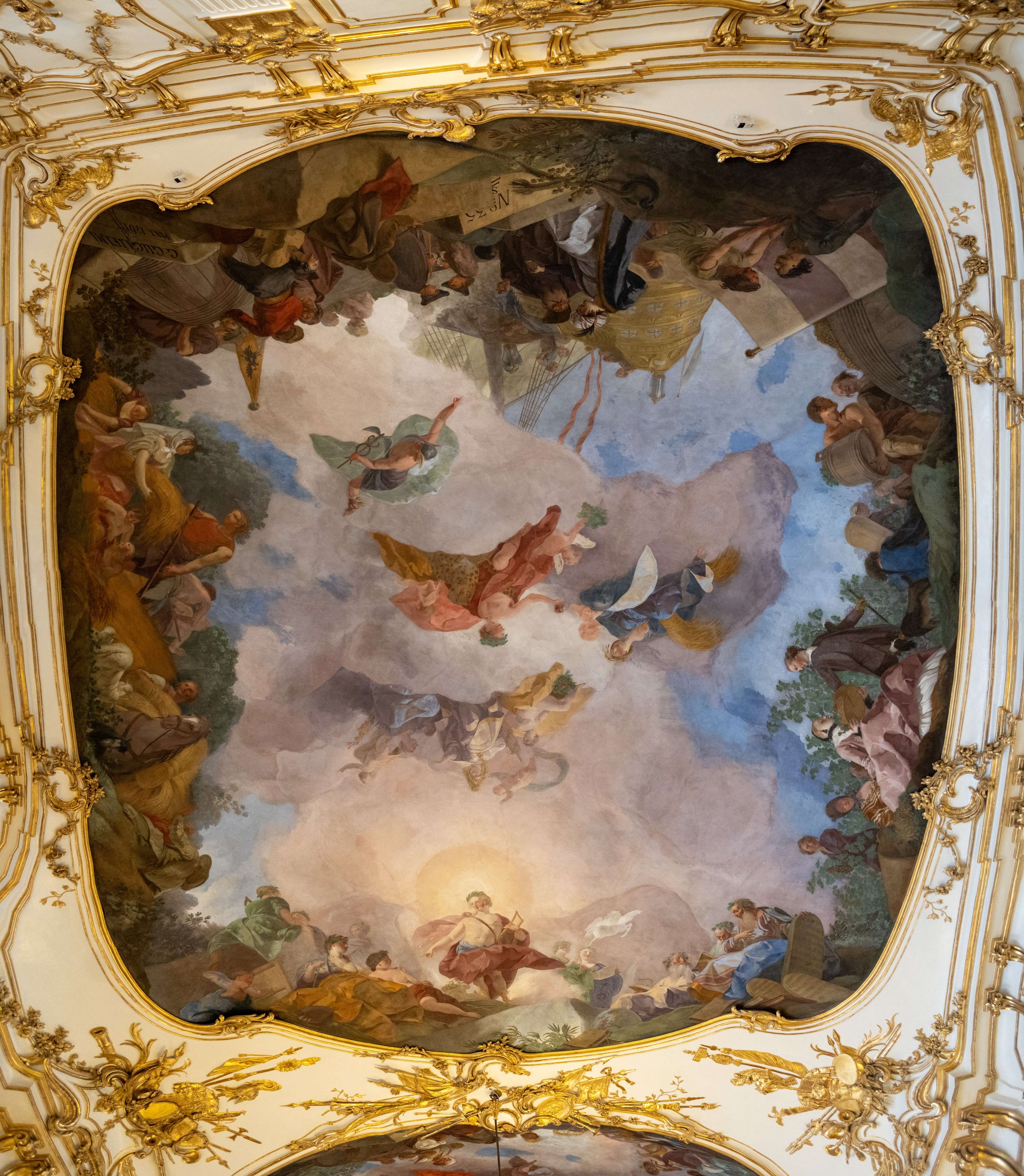 Arafed ceiling with a painting of angels and angels on it.