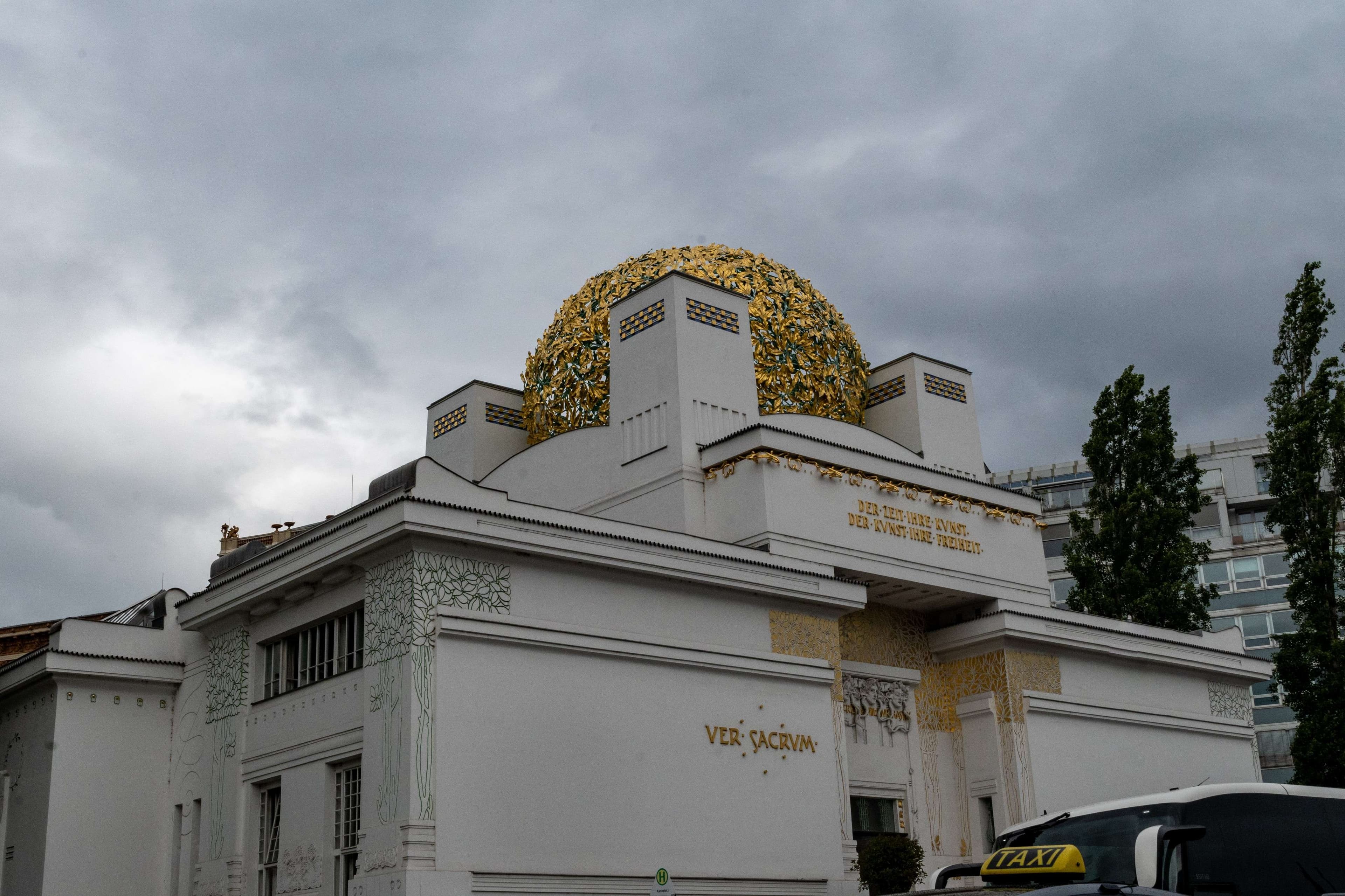 There is a white building with a gold dome on top.