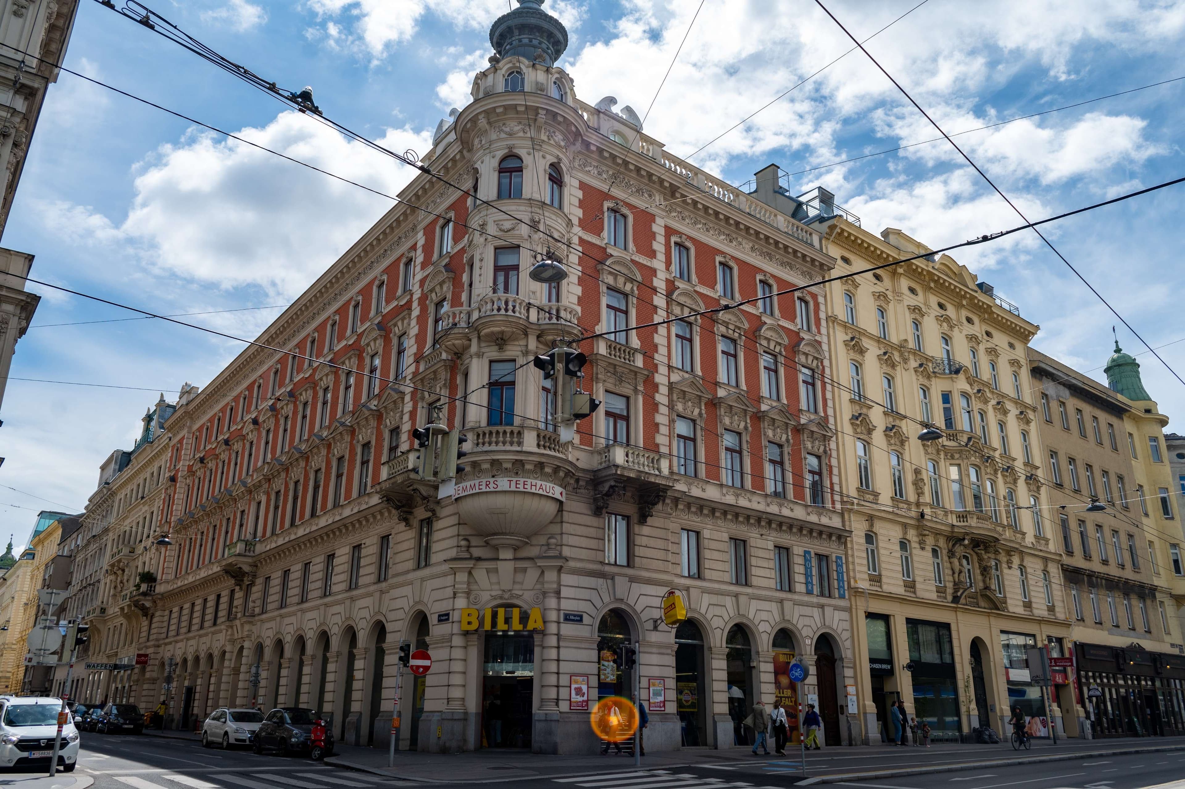 There is a large building with a clock on the top of it.