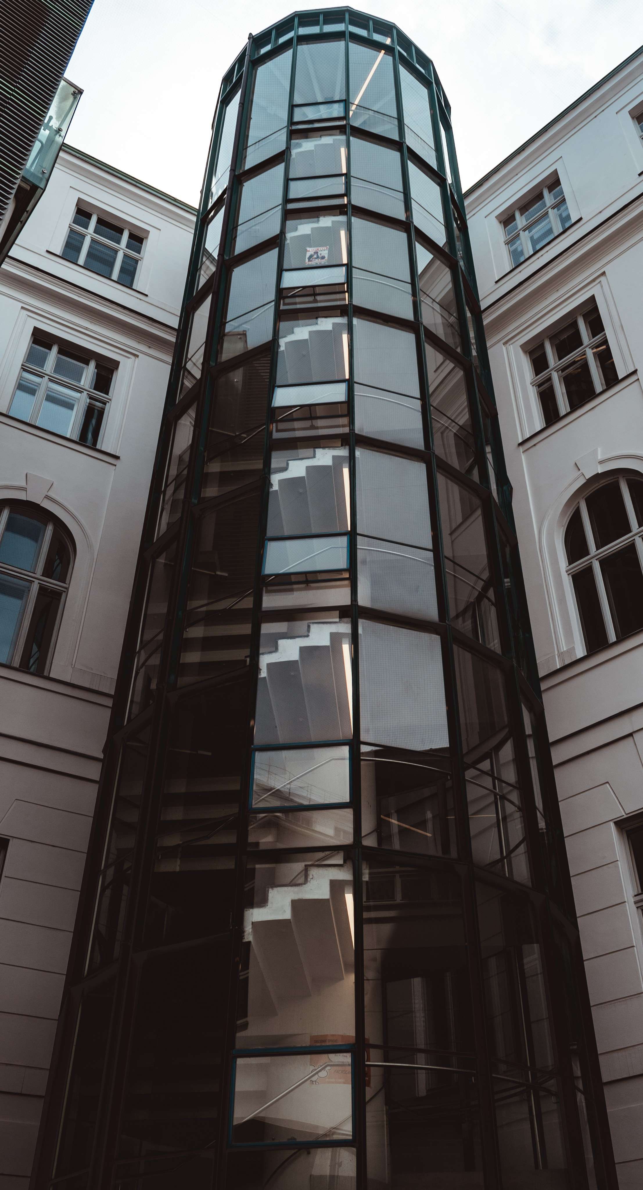 Arafed view of a tall building with a clock on the front of it.