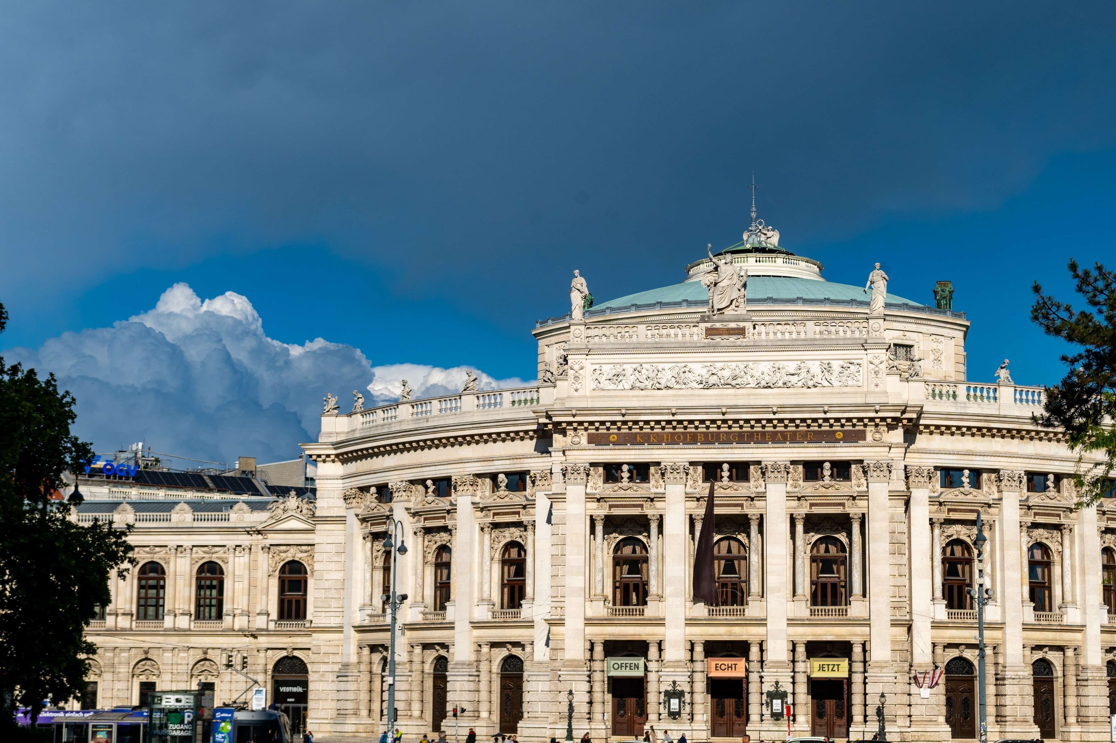 There is a large building with a clock on the top of it.