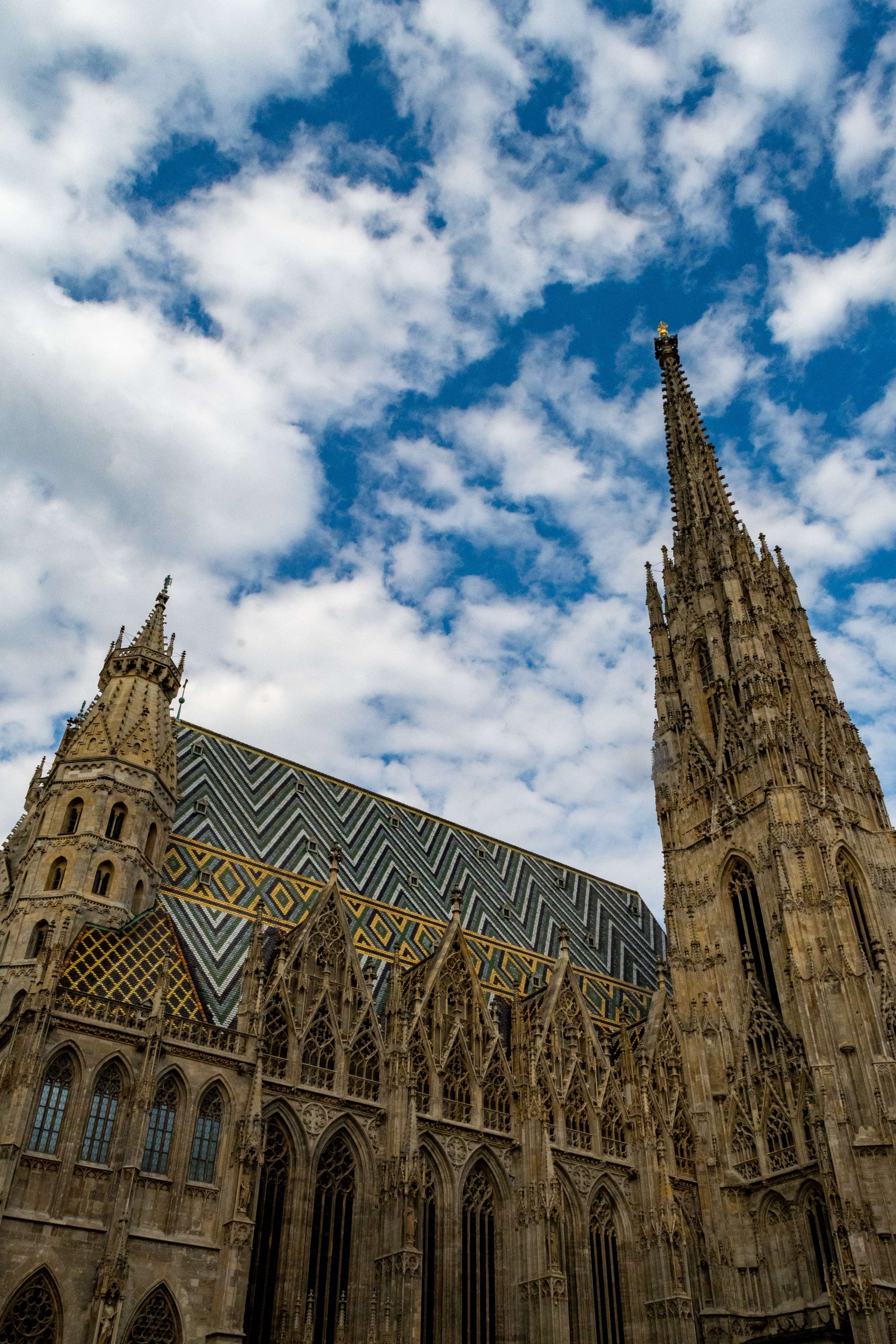 Arafed view of a large cathedral with a clock tower.