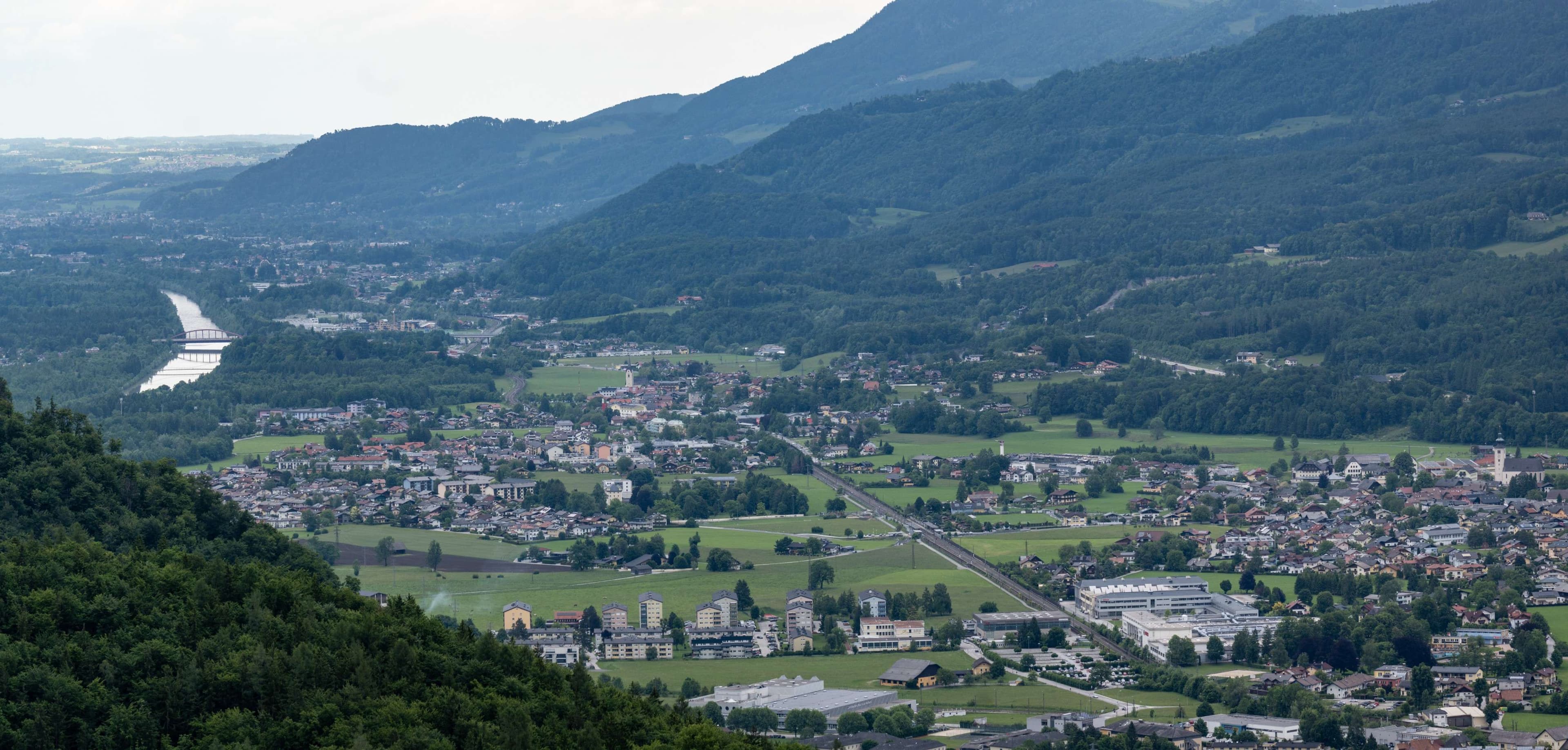 There is a view of a town from a hill top.