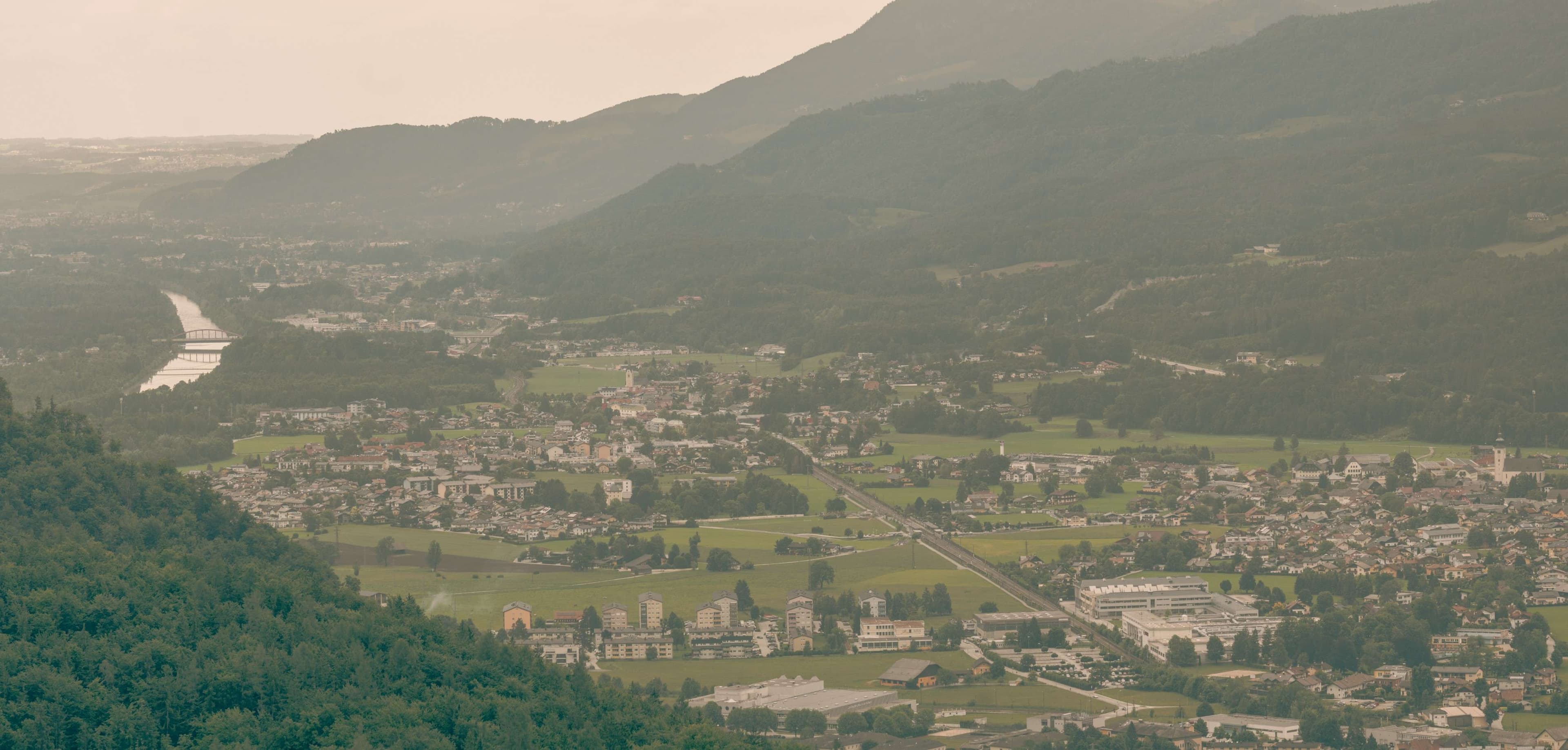 Mountains and valleys with a river running through them.