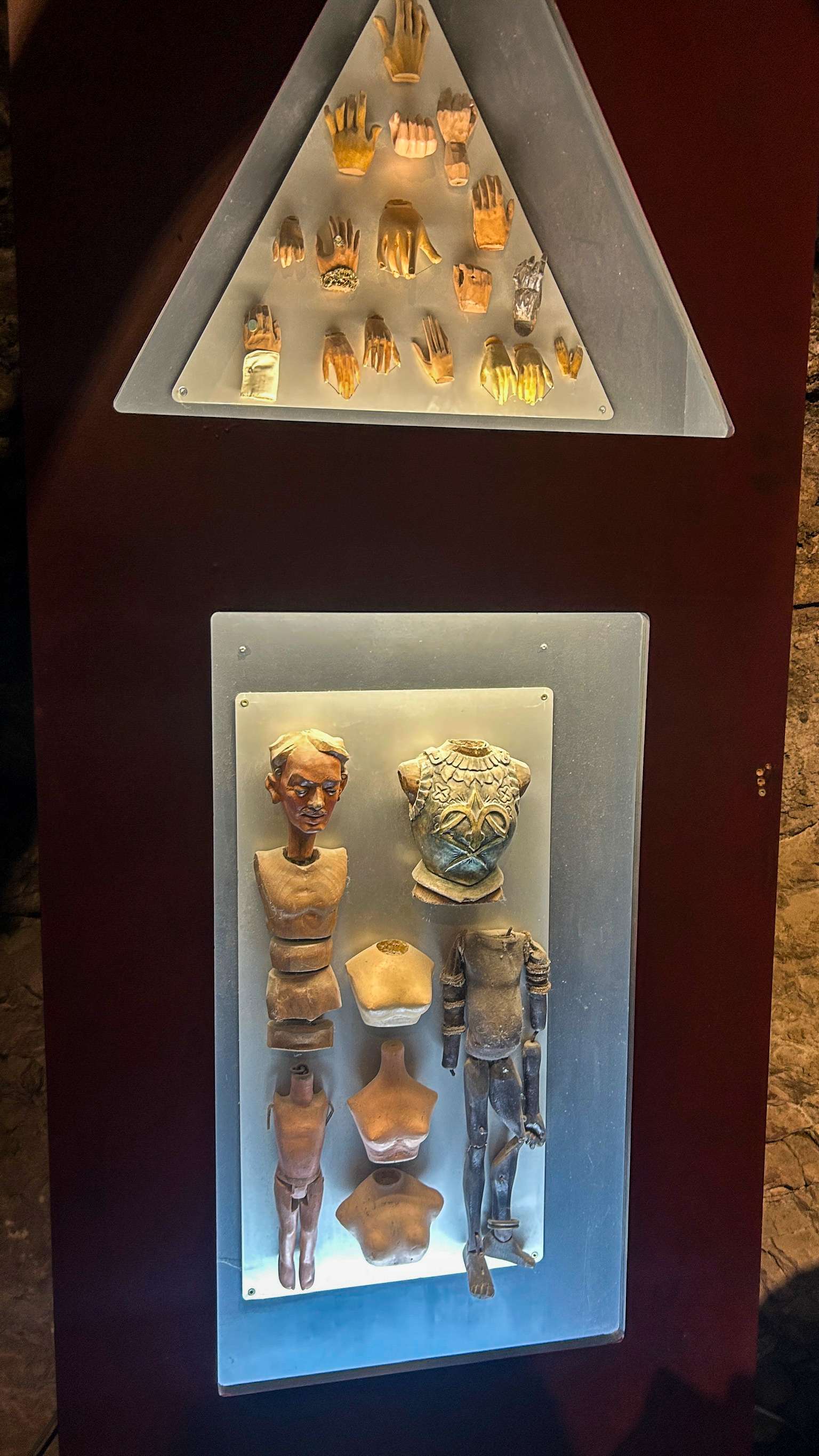 There are two display cases with different items in them.