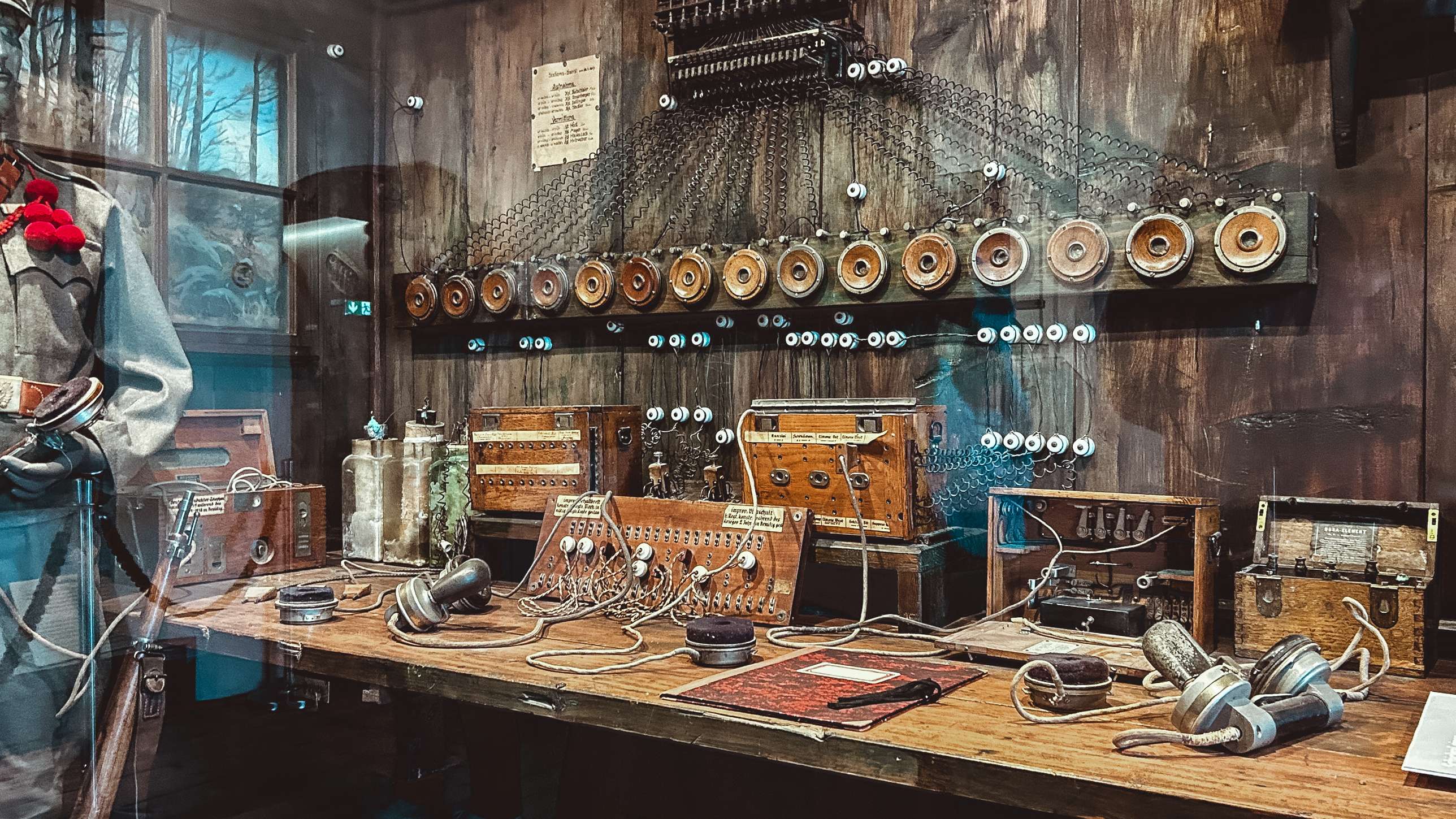 There is a display of old fashioned radio equipment on a table.