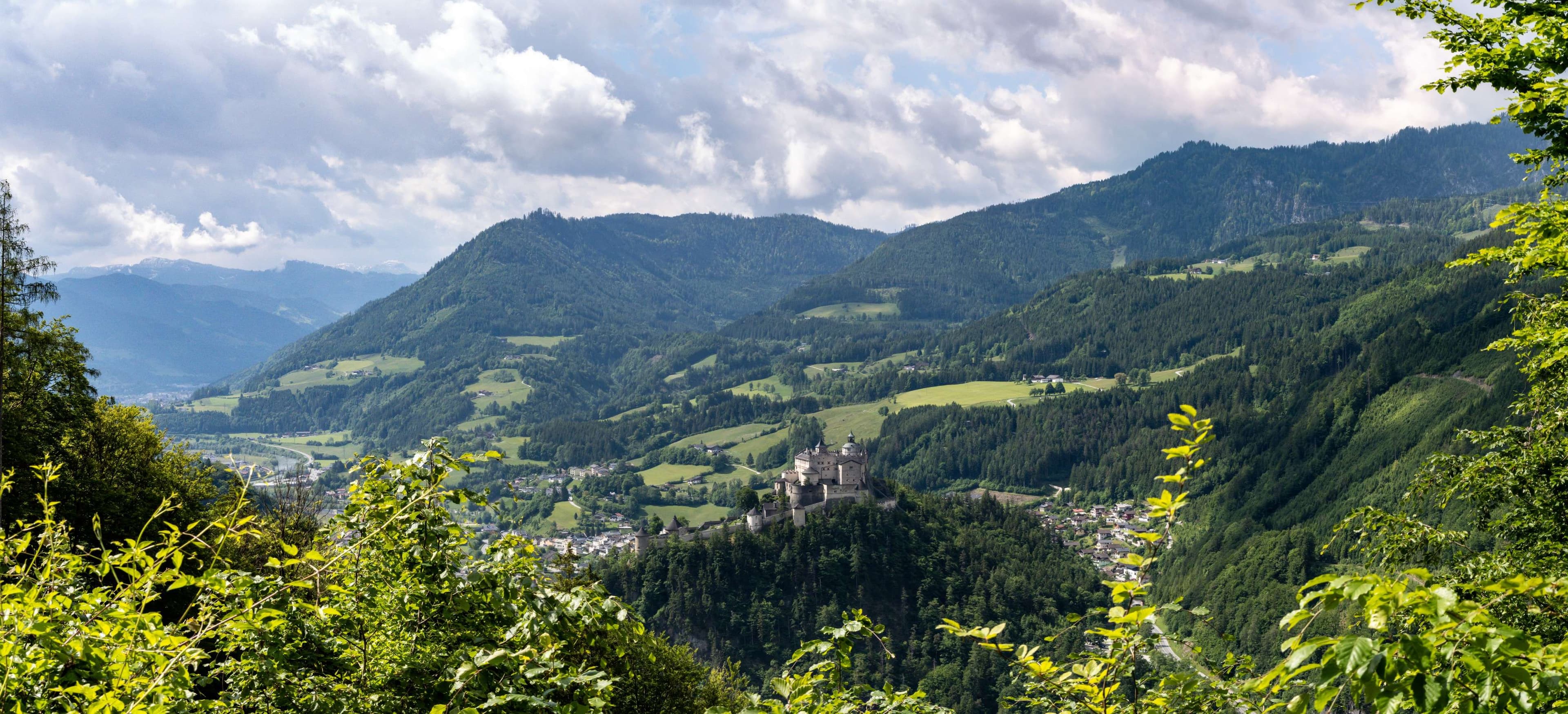 Mountains with a valley in the distance and a town in the distance.
