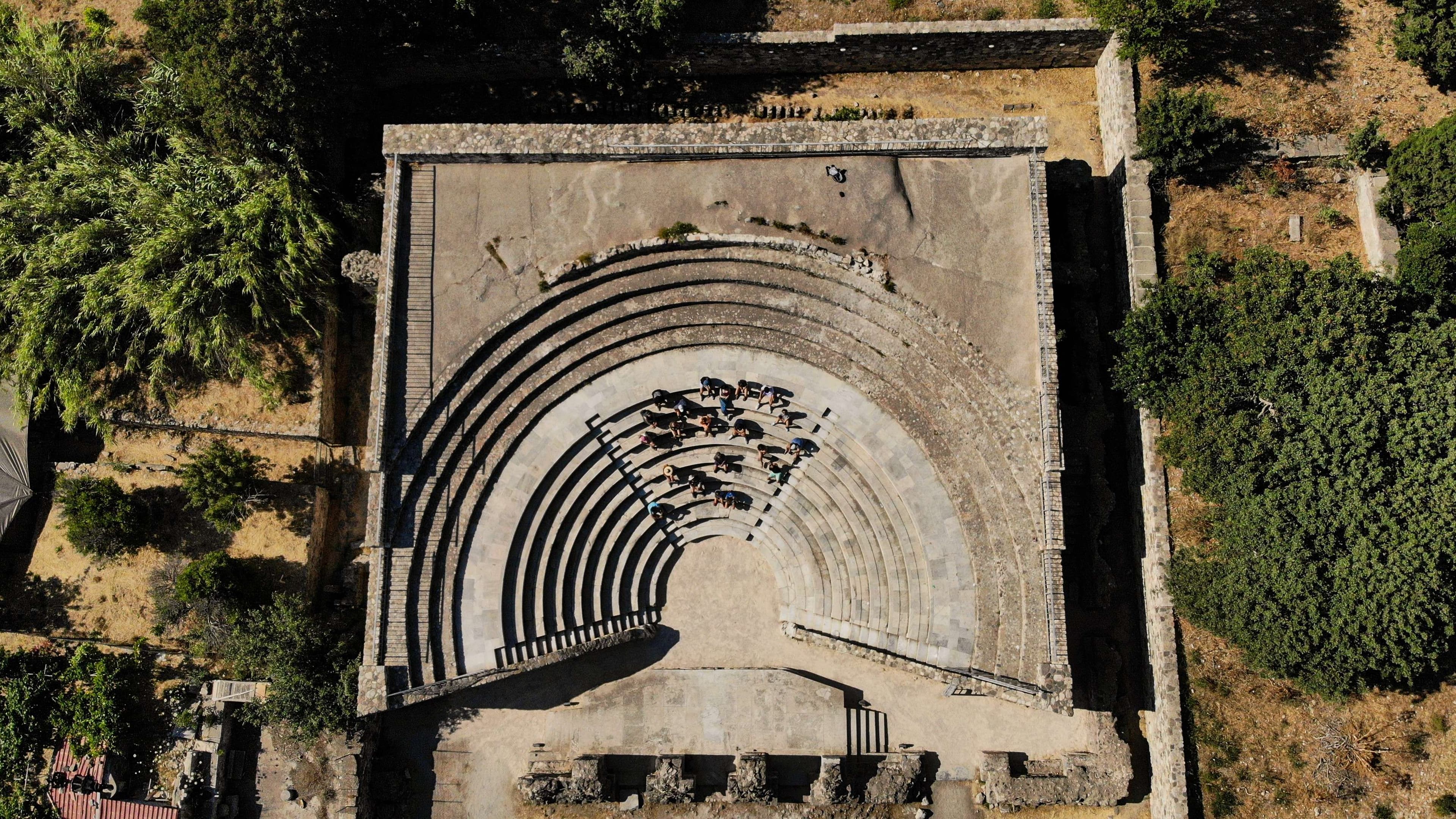 Aerial view of a large concrete structure with a circular design.