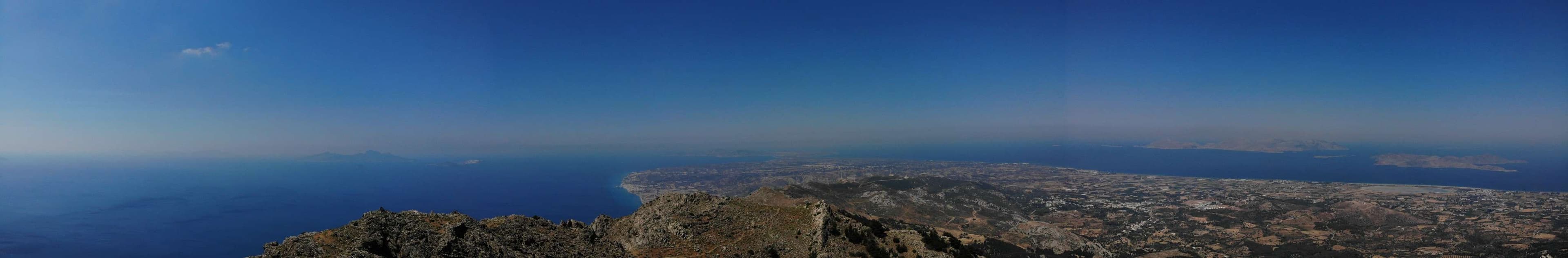 Arafed view of a mountain with a view of the ocean.