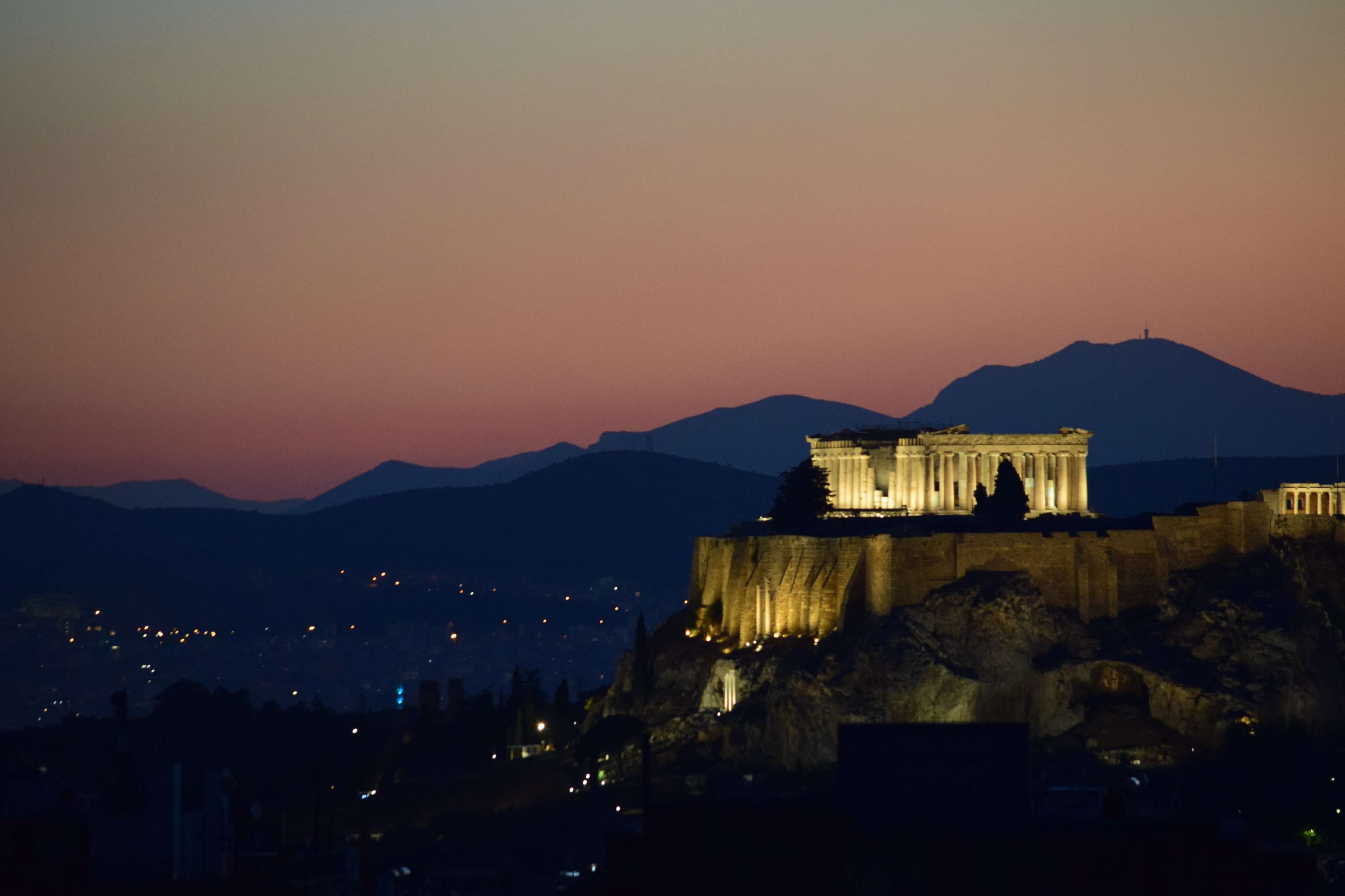 Arafed view of a hill with a building on top of it.