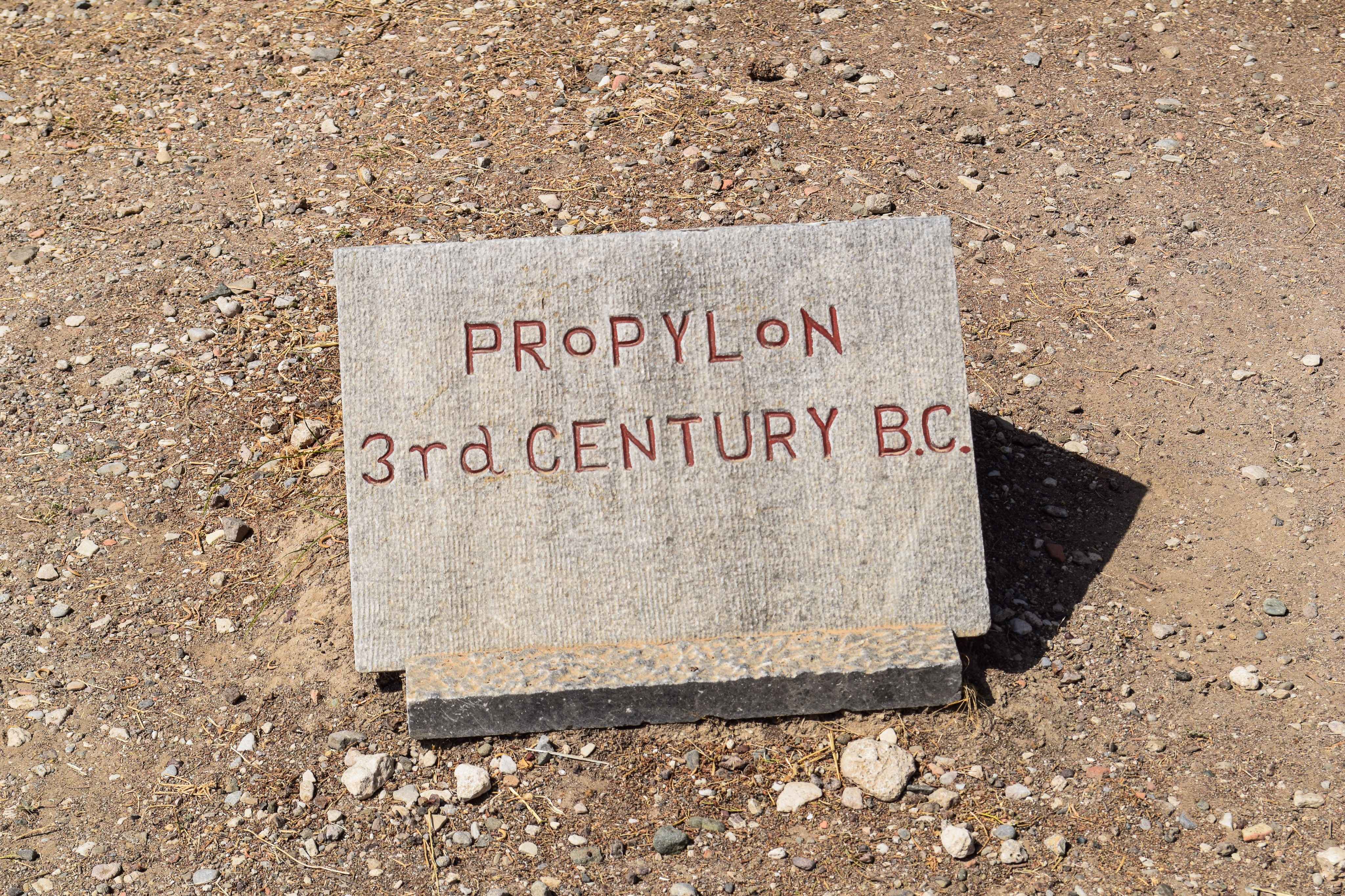 Arafed sign on the ground that says propylon 31st century bc.