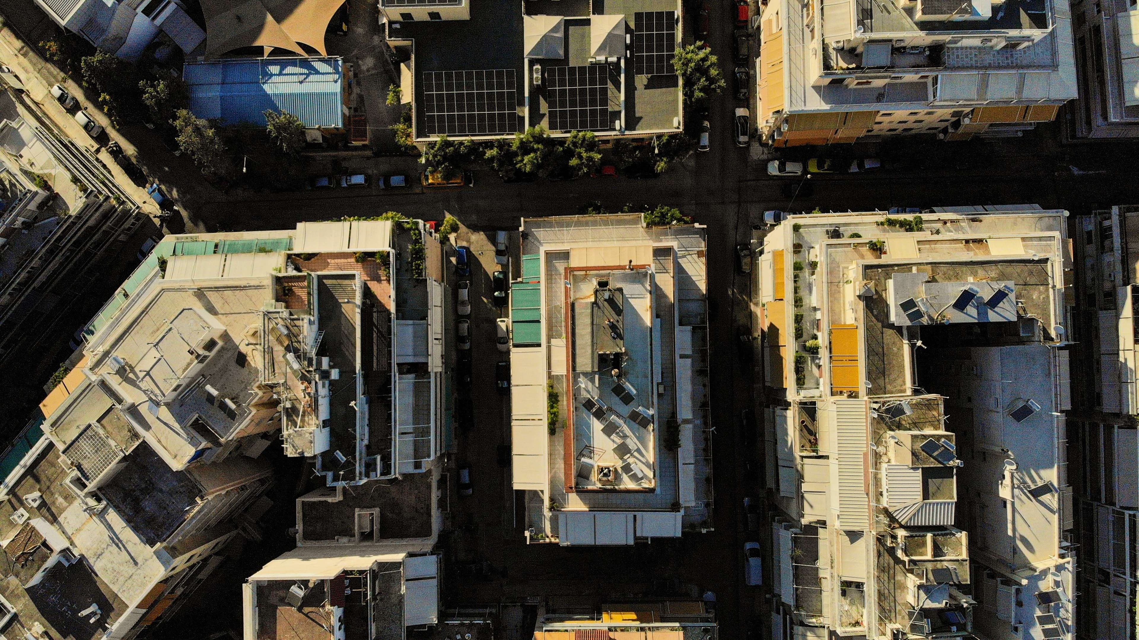 Aerial view of a city with a lot of buildings and a train.