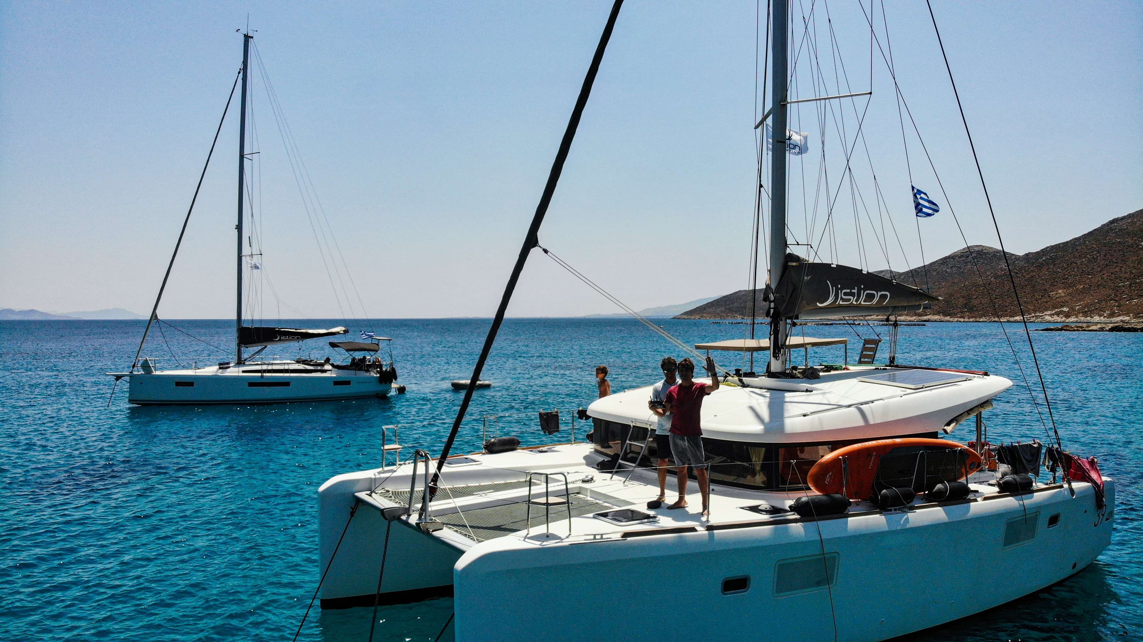 Boats in the water with people on them in the water.